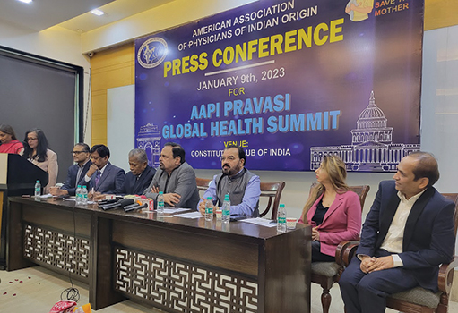 A group of people sitting at a press conference.