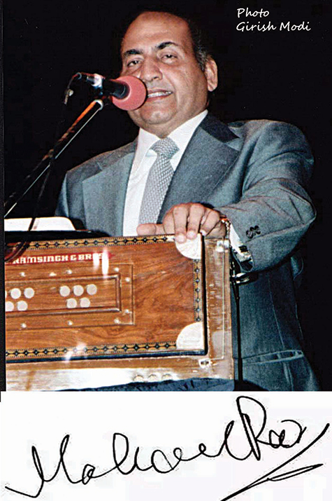 A man in suit and tie holding a wooden box.